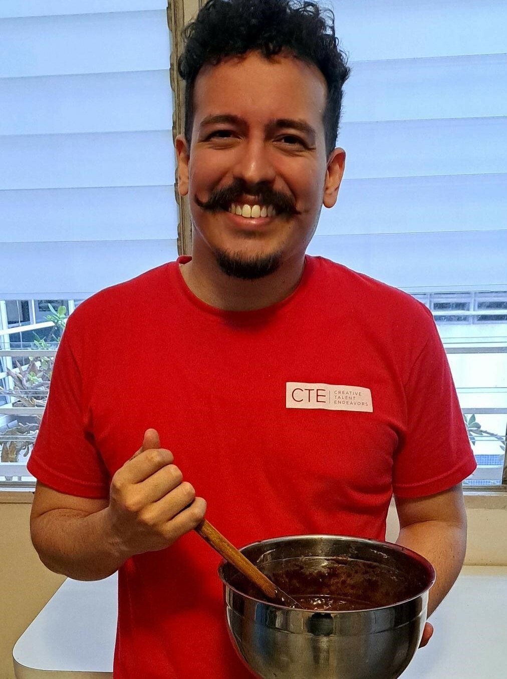 Alejandro mixing brownies