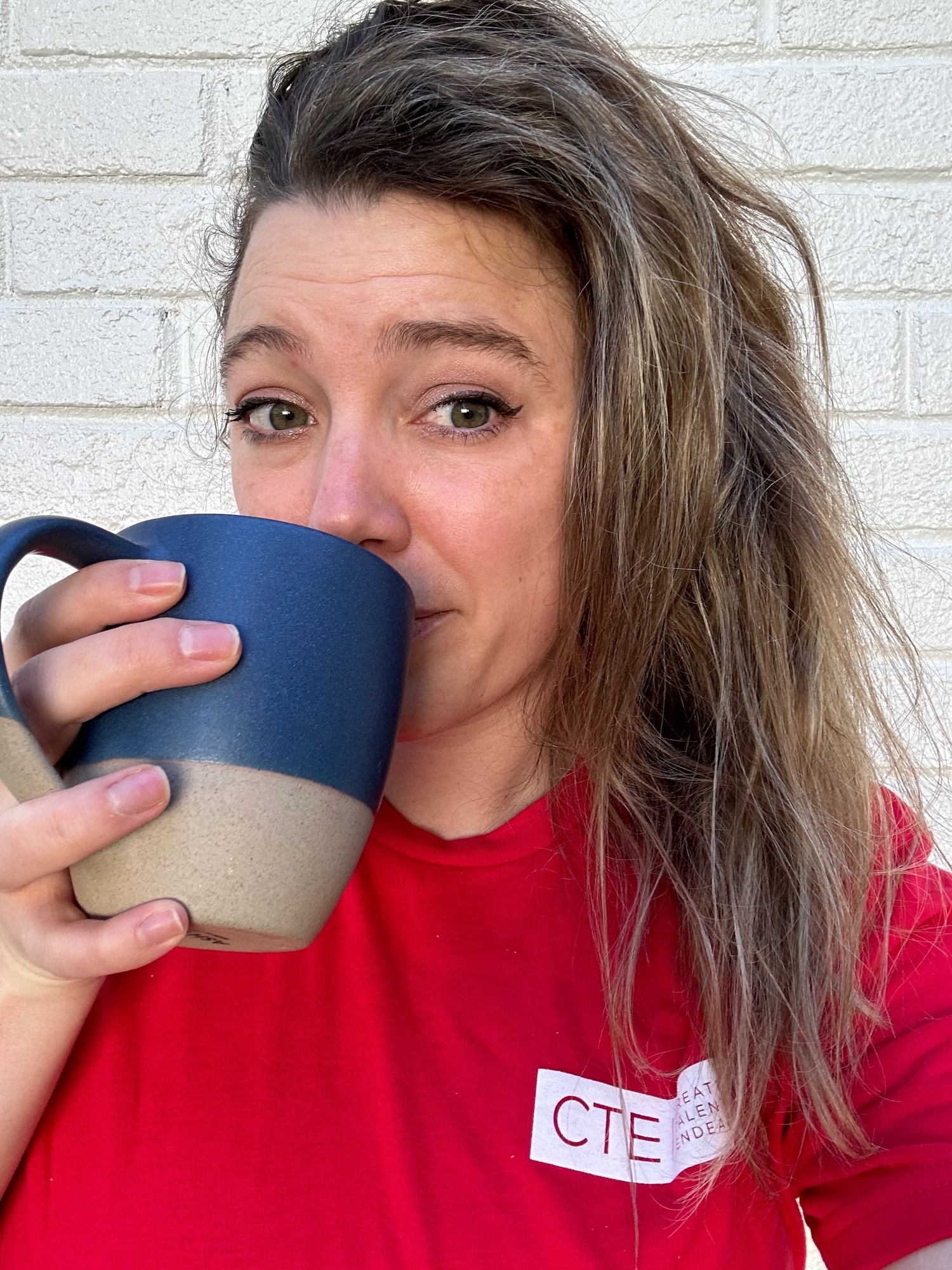 Brittany enjoying a cup of coffee
