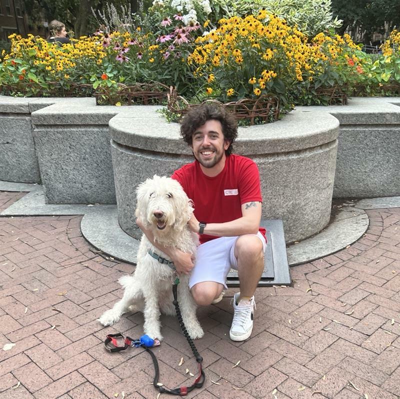 Matt sitting with his dog